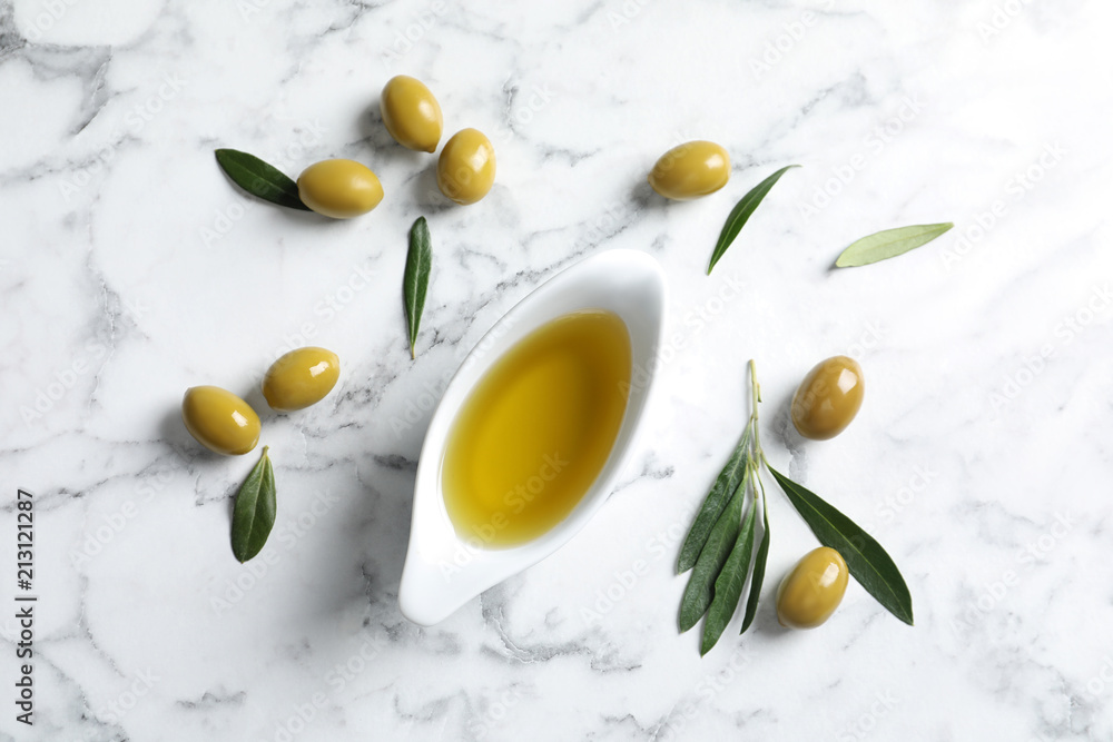 Flat lay composition with fresh olive oil on marble background Flat lay composition with fresh olive oil on marble background