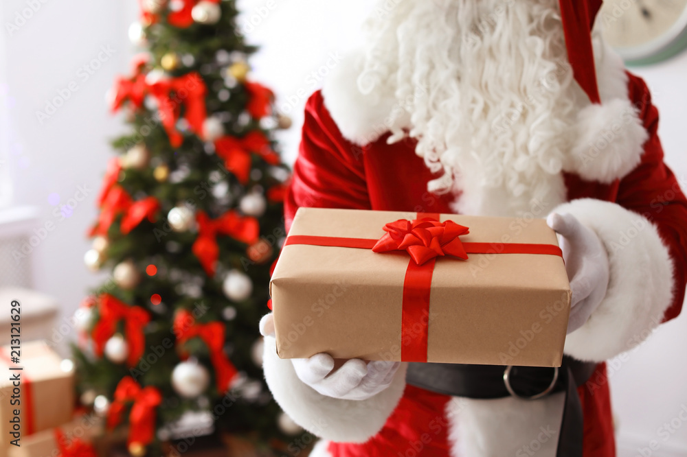 Authentic Santa Claus with gift box indoors Authentic Santa Claus with gift box indoors