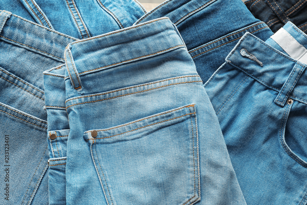Jeans of different colors as background
