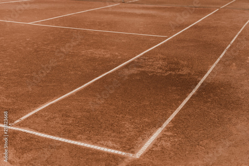 brown tennis court with white marking lines © LIGHTFIELD STUDIOS