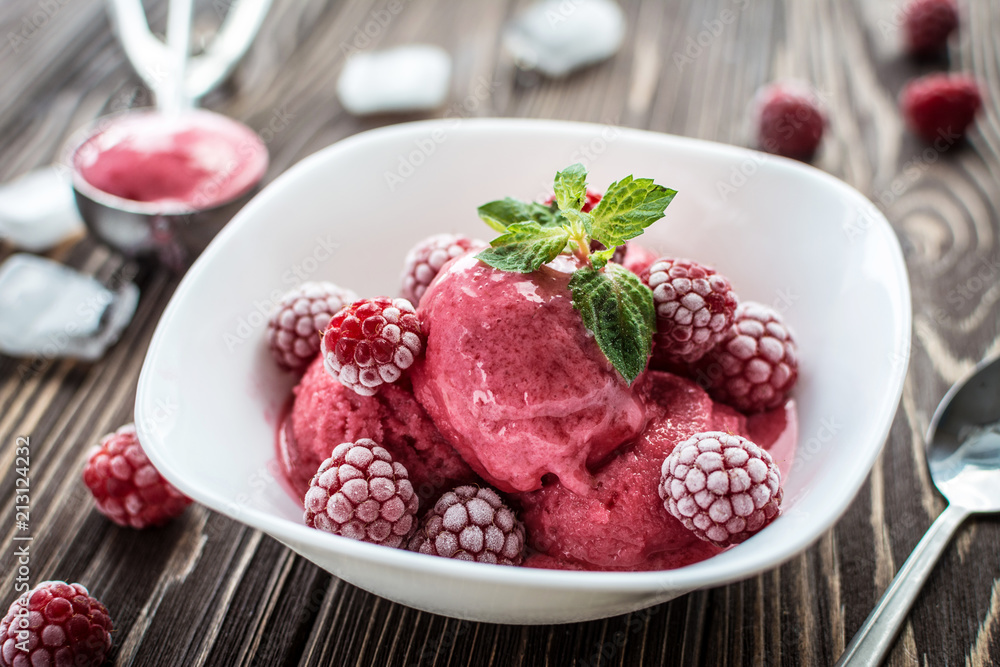 Delicious ice cream made from fresh berries on a wooden background Delicious ice cream made from fresh berries on a wooden background