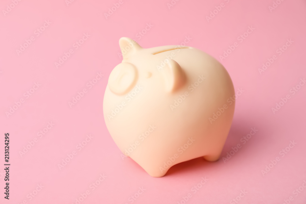 Cute piggy bank on color background. Money saving