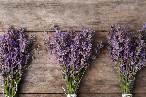 Fototapeta Naklejka Na Ścianę i Meble -  Flat lay composition with lavender flowers on wooden background