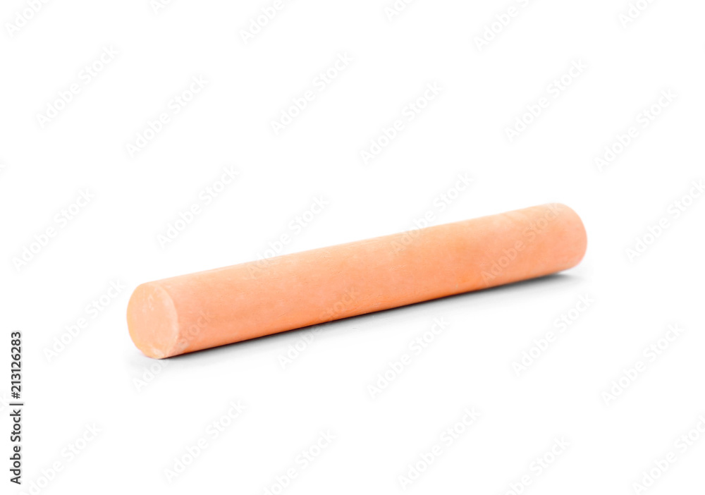 Orange piece of chalk on white background Orange piece of chalk on white background