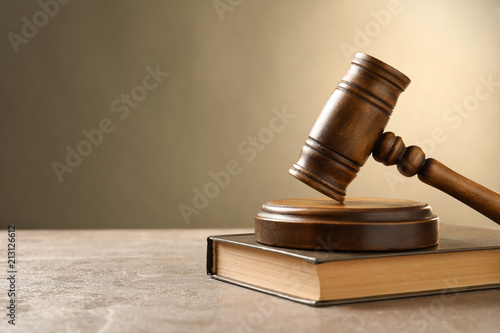 Wooden gavel and book on table. Law concept