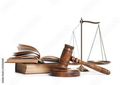 Wooden gavel, scales of justice and books on white background. Law concept