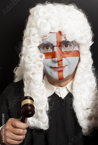 Canvastavla Portrait of male english lawyer with painted english flag holding judge gavel