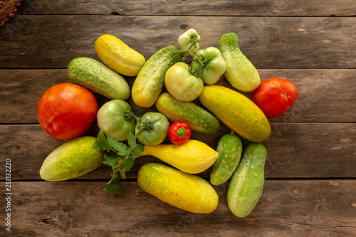 Garden fresh squash cucumber tomato onion pepper with background copy space