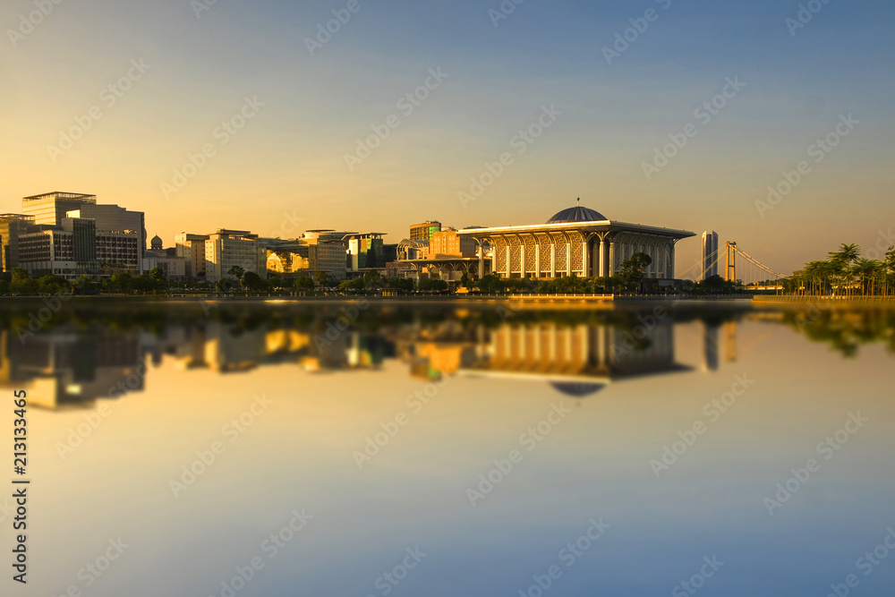 Scenery of Sunrise at 'Sultan Mizan Mosque,Putrajaya' with clear blue sky.Soft Focus,Blur due to Long Exposure. Visible Noise due to High ISO.