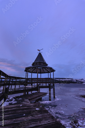 Scenic View Of Frozen Lake Against Pier
