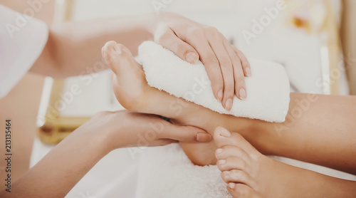 Beautiful Clean Female Legs in Spa Composition.