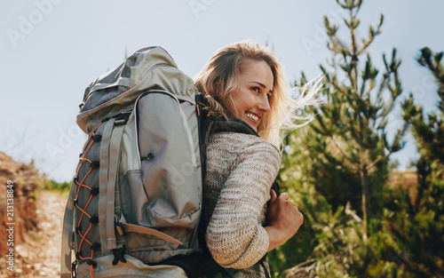 Smiling woman going on a camping