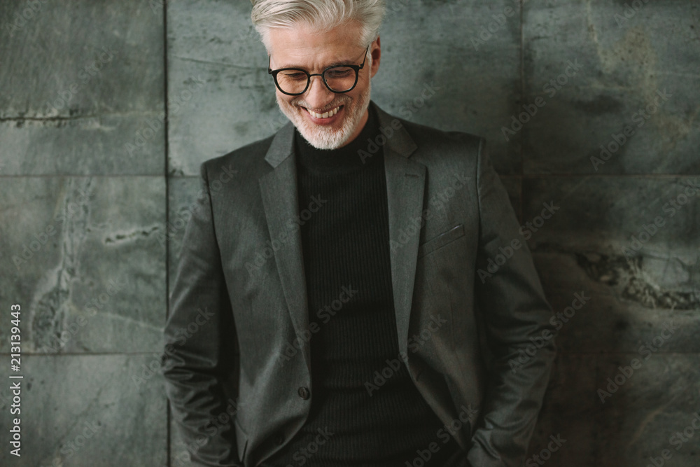 Fototapeta premium Portrait of smiling senior businessman