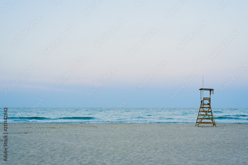 Lifeguard watchtower on the beach at sunset. Lifeguard watchtower on the beach at sunset.