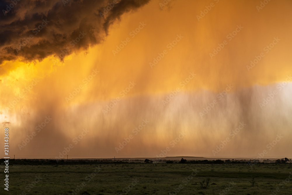 Pouring rain at sunset