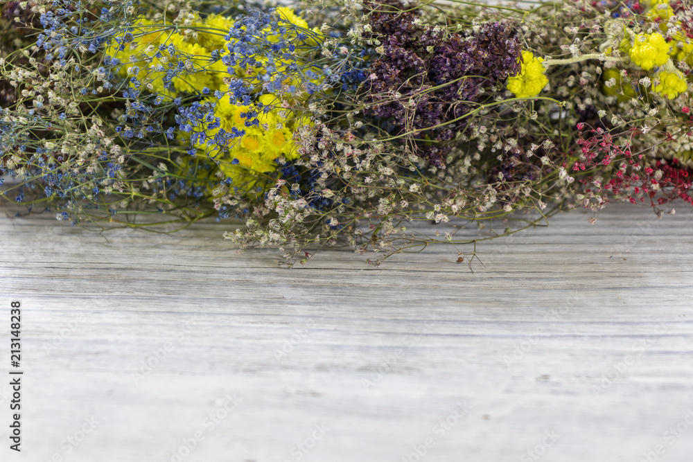 background. defocusing. fragment of a wreath of colored wildflowers background. defocusing. fragment of a wreath of colored wildflowers