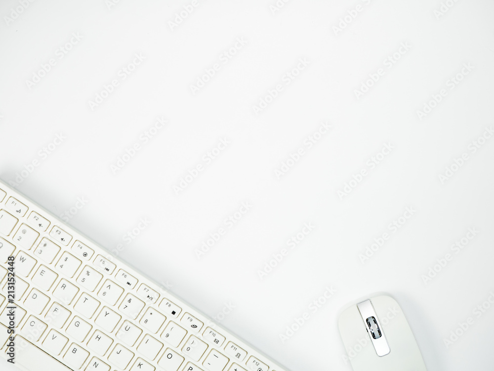 Modern white office desk table with keyboard computer and other office supplies of necessity, Top view with copy space Modern white office desk table with keyboard computer and other office supplies of necessity, Top view with copy space