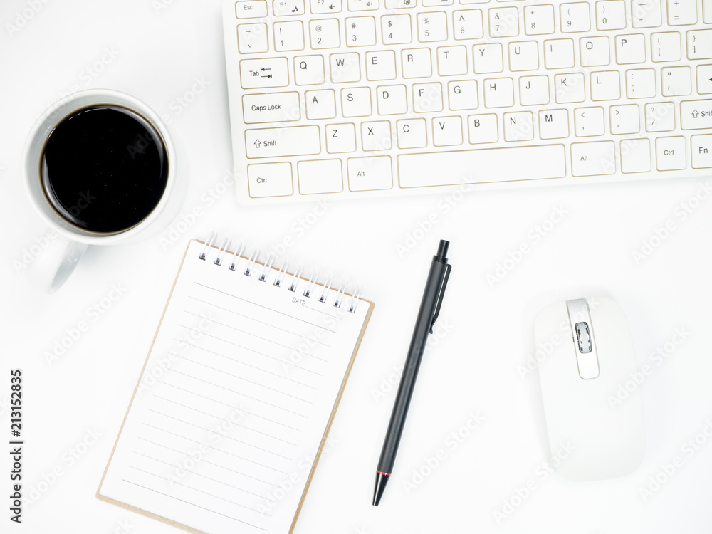 Modern white office desk table with keyboard computer, coffee and other office supplies of necessity, Top view with copy space Modern white office desk table with keyboard computer, coffee and other office supplies of necessity, Top view with copy space