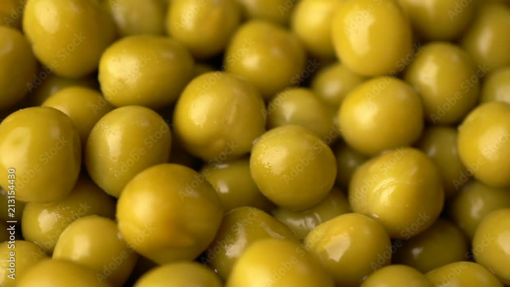 Green pickled peas rotate background. Green pickled peas rotate background.
