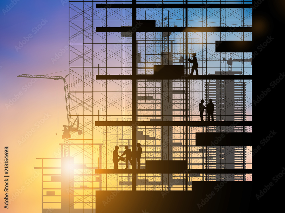 Silhouette of engineer and construction team working at site over blurred background sunset pastel for industry background with Light fair.Create from multiple reference images together. Silhouette of engineer and construction team working at site over blurred background sunset pastel for industry background with Light fair.Create from multiple reference images together.