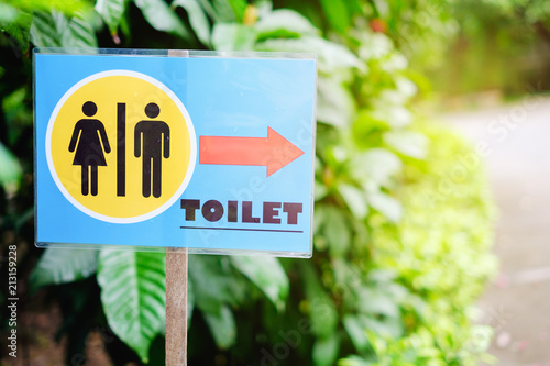 Toilet sign in garden.