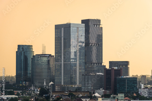 Sunset over skyscrapers in the Jakarta business district aournd Semanggi in Indonesia capital city. Jakarta is the largest city in Southeast Asia and an important financial center.