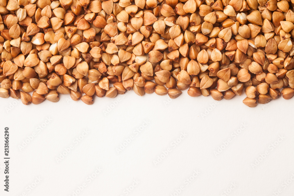 Raw buckwheat on white background