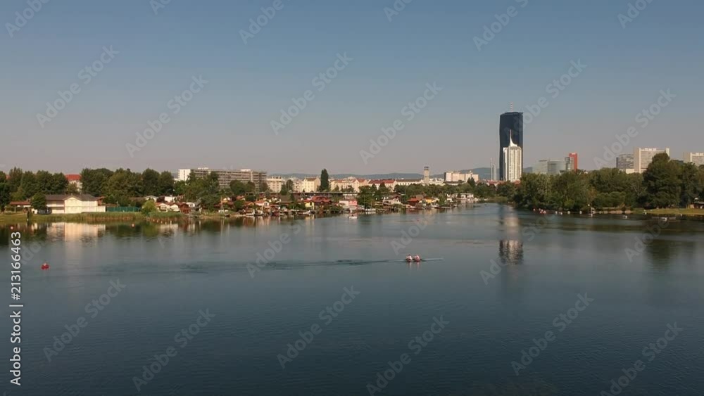 Drone flight over Alte Donau viewing Donaucity in Vienna, Austria Drone flight over Alte Donau viewing Donaucity in Vienna, Austria