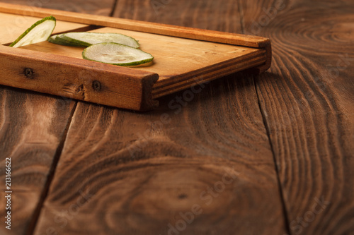 Fresh cucumber, chopped cucumber, isolated on wooden board photo