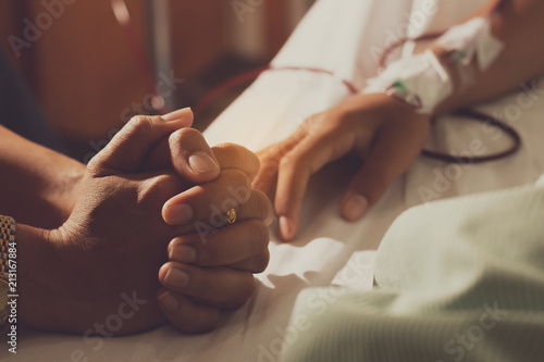 Wallpaper Mural  closeup of people's hands handful  worry about the patient  in the hospital bed. Torontodigital.ca