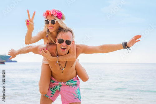 Cheerful laughing couple on the beach