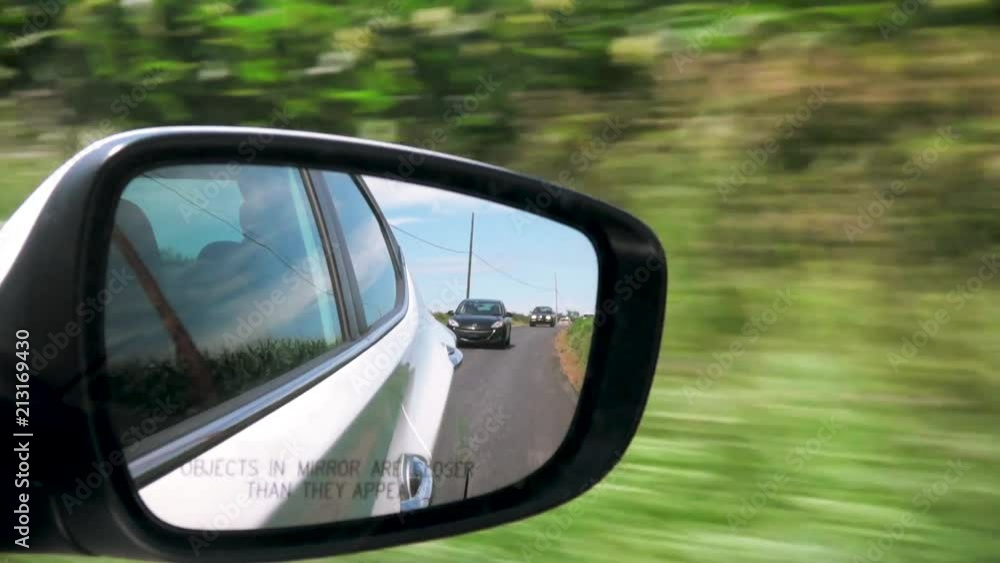 Side view mirror reflection o a car while driving Side view mirror reflection o a car while driving