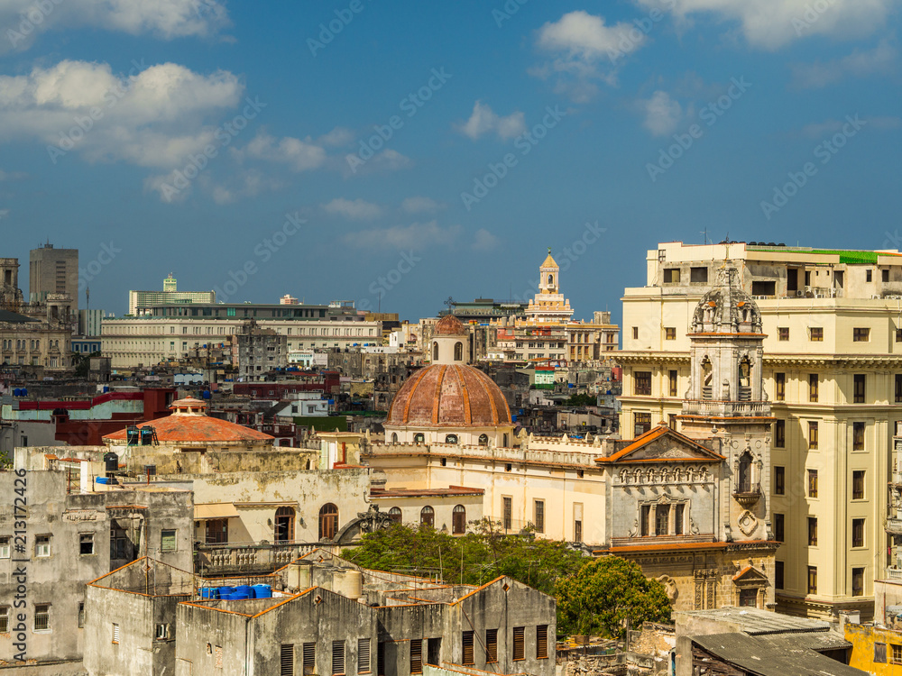 Havana streets with bright colours and cuban flags