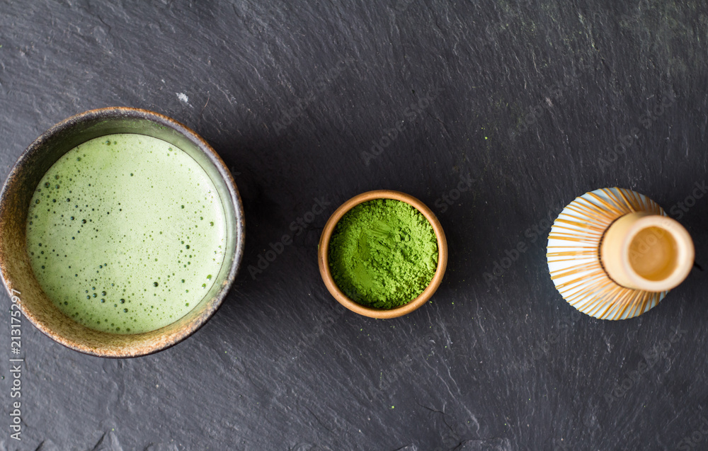 green matcha tea prepearing on stone black table green matcha tea prepearing on stone black table