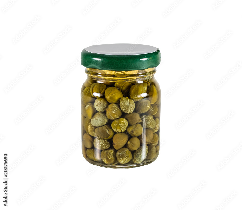 Canned capers in a glass jar. Isolated on white. Canned capers in a glass jar. Isolated on white.