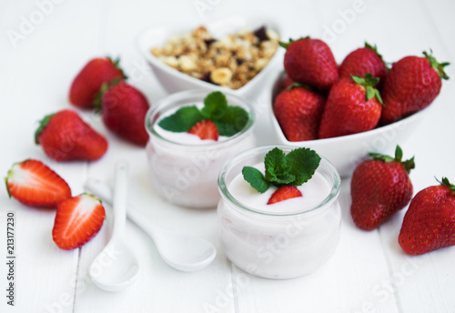 healthy breakfast  yogurt  fresh strawberries and granola