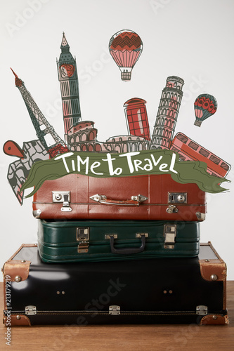 Stacked old leather suitcases with Time to travel inspiration and cities illustration