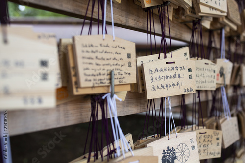 Tokyo, Japan - 13 October, 2017: Wooden blessing Plates in Meiji Jingu Shrine, . It is the traditional way to send a prayer to the gods. photo