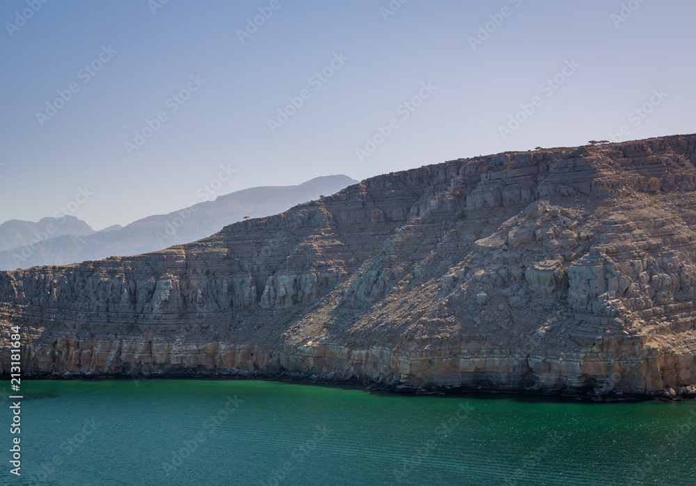 Fototapeta premium Sunrise in Muscat view from a Ship