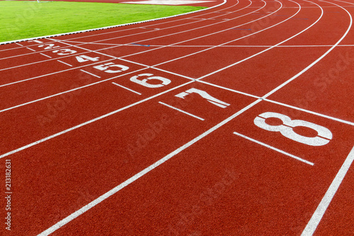 Fototapeta Naklejka Na Ścianę i Meble -  Red treadmill at the stadium