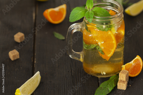 Refreshing summer cocktail with chopped ice and citrus fruits