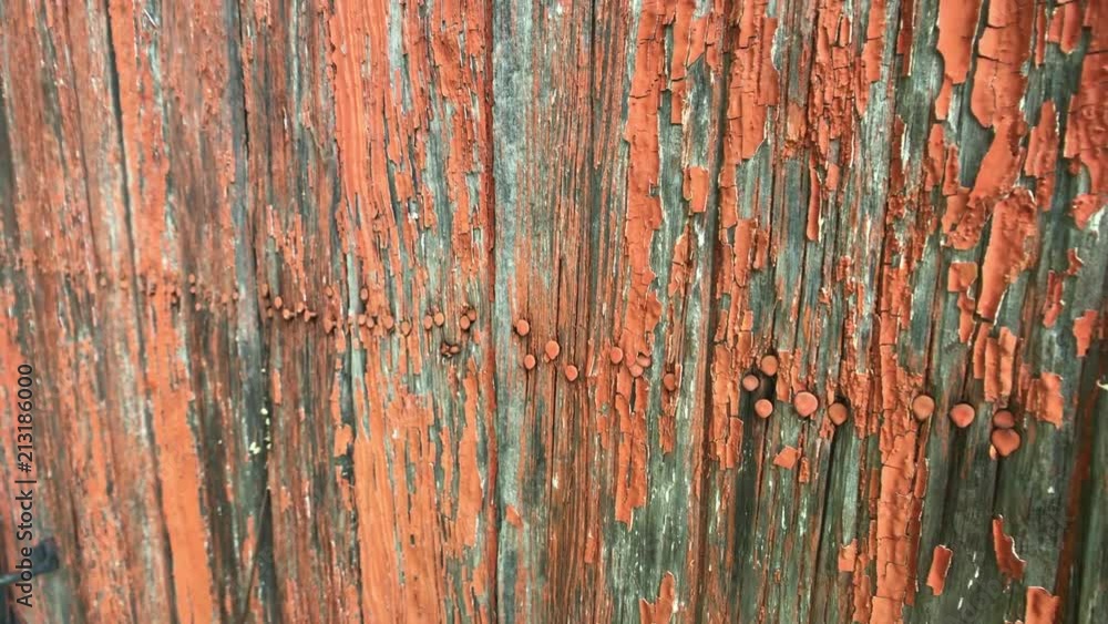 Rustic abandoned building with colorful chipped paint - pans right Rustic abandoned building with colorful chipped paint - pans right