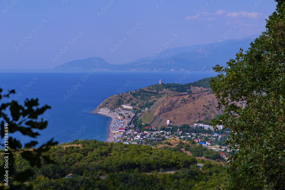 The coast of the resort town with hotels, restaurants and beaches in the background of the wide blue sea