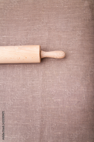 Baking ingredients. Flour, eggs, wheat and rolling pin on  table cloth. Rustic. Copy space