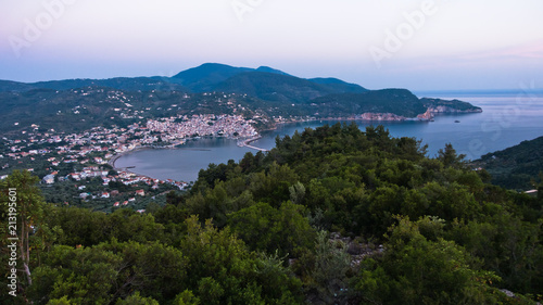 Aerial view of Skopelos harbour and town before sunrise, island of Skopelos, Greece