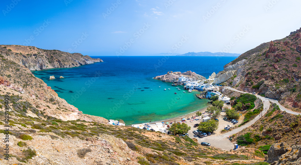 Scenic Firopotamos village (traditional Greek village by the sea, the Cycladic-style) with sirmata - traditional fishermen's houses, Milos island, Cyclades, Greece.