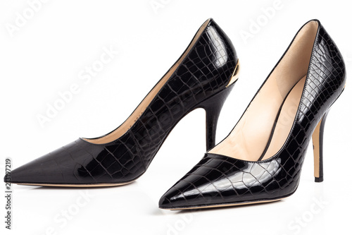 Black shiny elegant high heel shoes isolated on white background. 