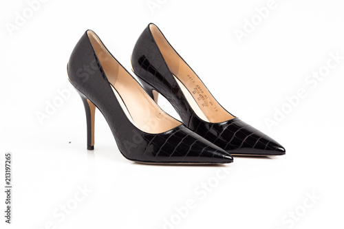 Black shiny elegant high heel shoes isolated on white background. 