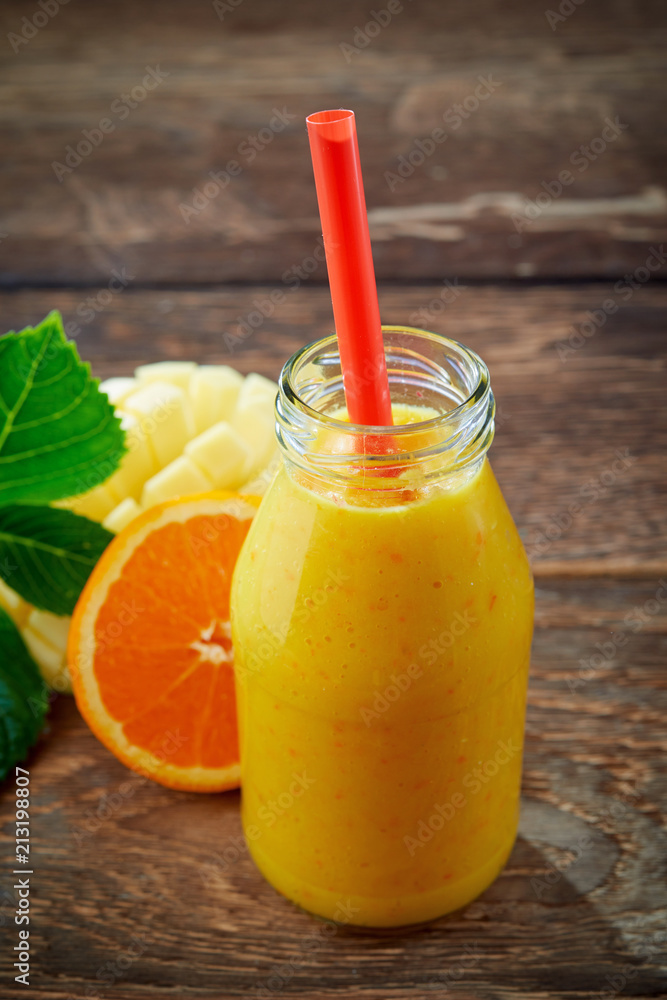 Fototapeta premium Healthy fresh orange and mango smoothie