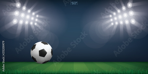 Soccer football ball on green grass of soccer field or football field stadium background. Vector.
